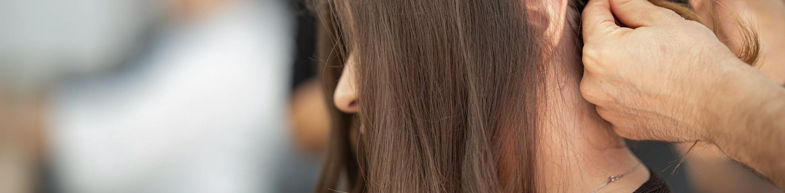 Someone getting their hair cut